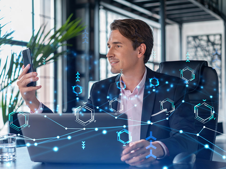man with phone working at the office
