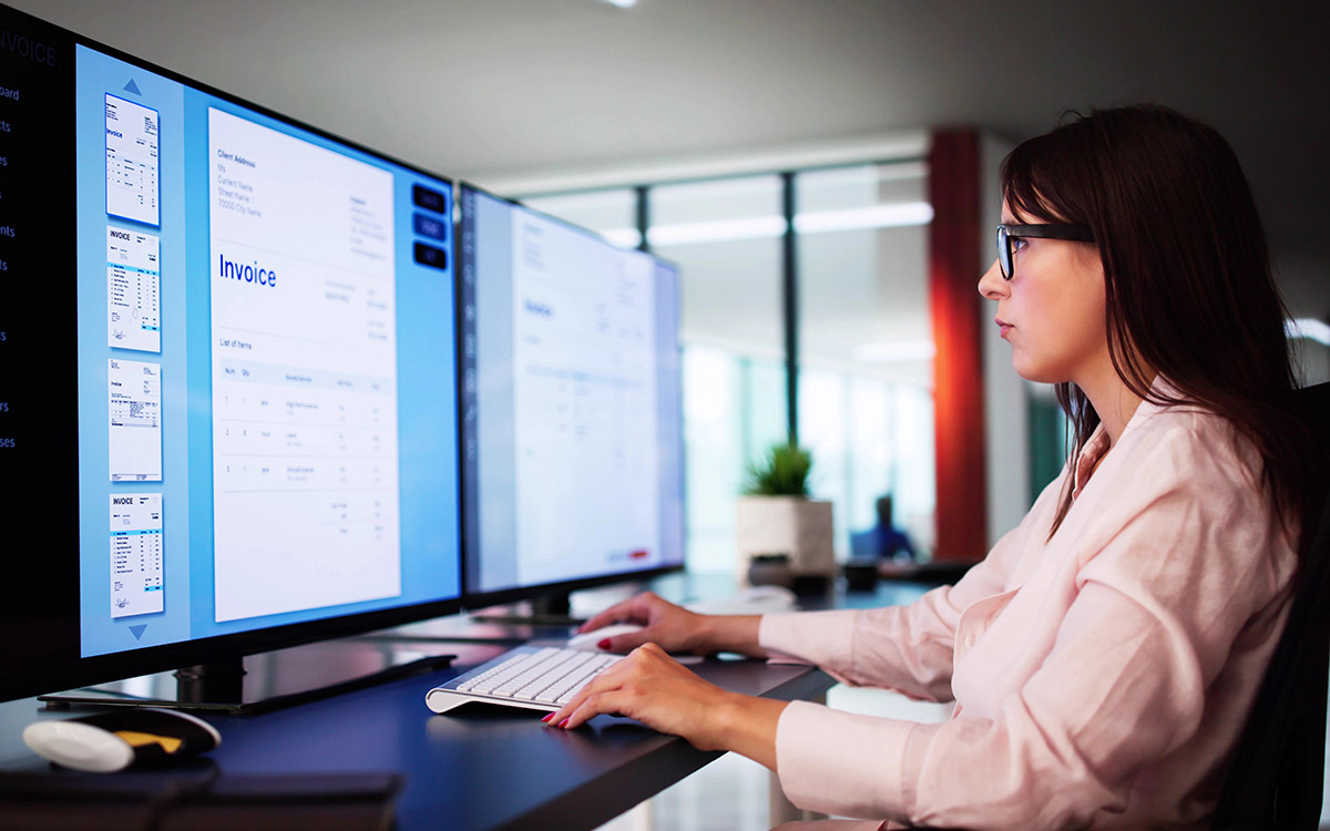 woman working on invoice processing