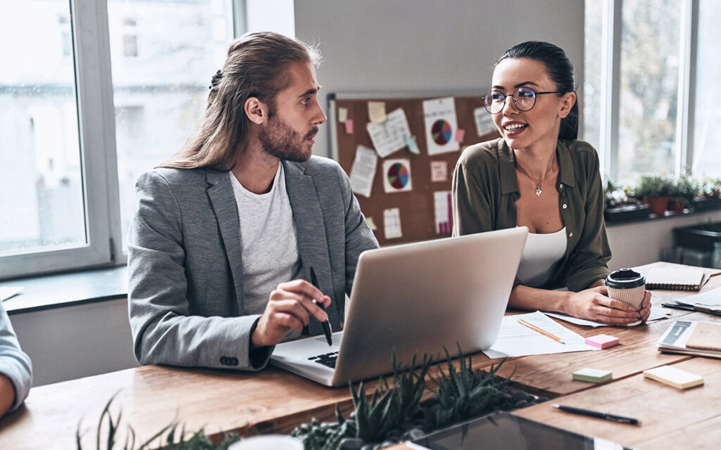 team at the office discussing workflow